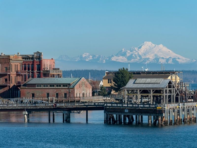 View of the marina with a mountain covered in snow in the distance