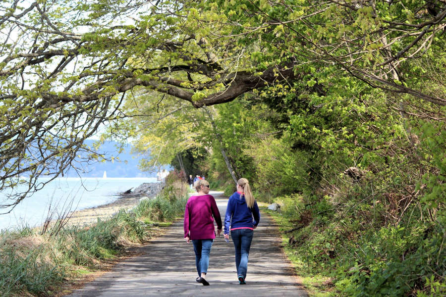 Walkers o the Geumes Channel Trail in Anacortes, Washington