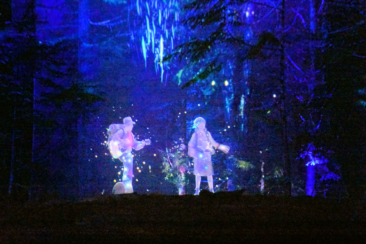 Multimedia father and daughter singing at Vallea Lumina in Whistler, British Columbia.