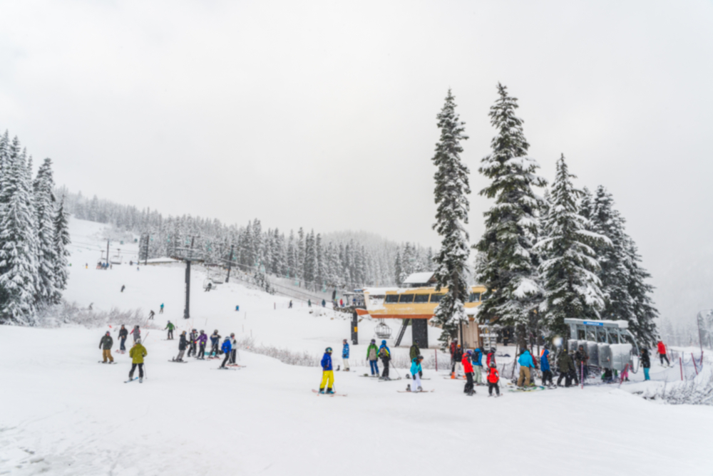 Lots of skiers gathering around a chairlift at Stevens Pass Ski Area close to Leavenworth Washington