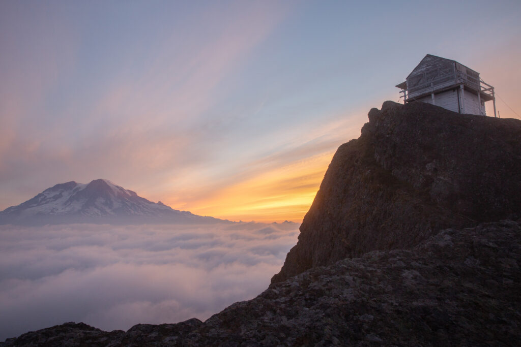 sunset at high rock washington with a lookout tower to the right of the photo