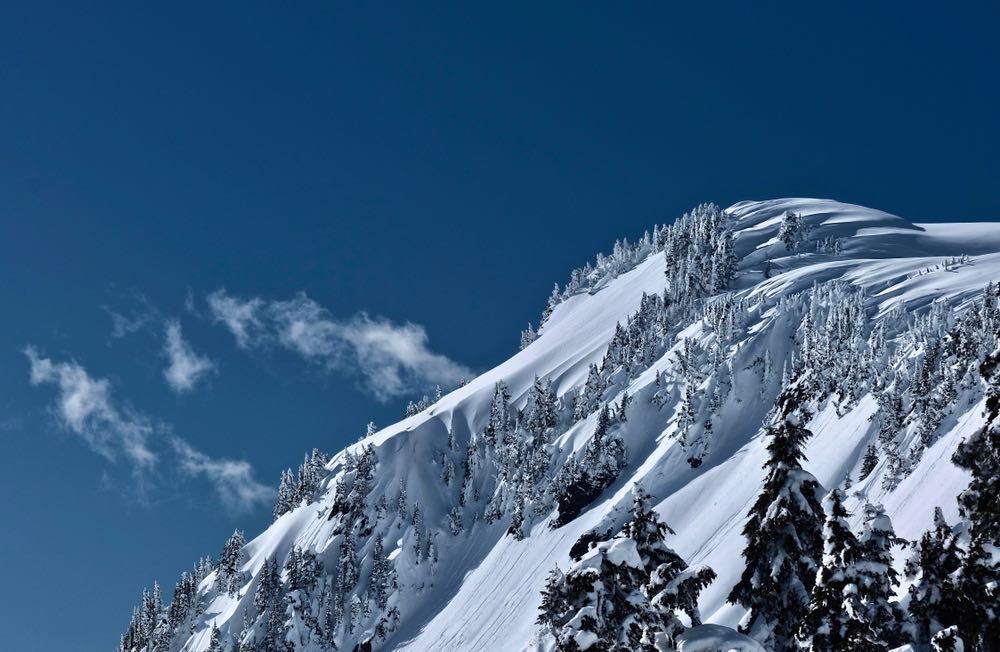 A view of the snow-covered mountains on a sunny winter day hiking in Washington State's famous Artist's Point area.