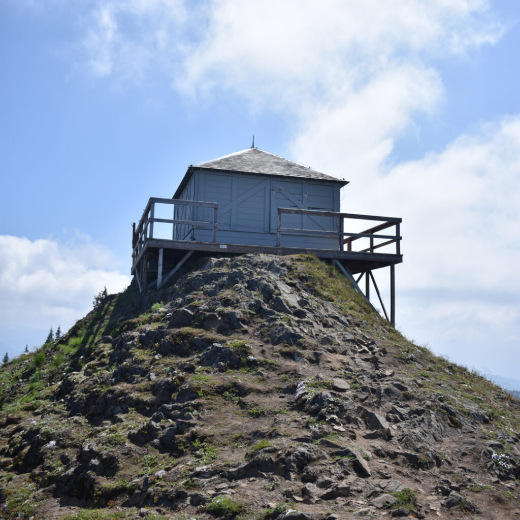 old white wood fire lookout stand at kelly butte lookout, one of the best hiking trails close to seattle