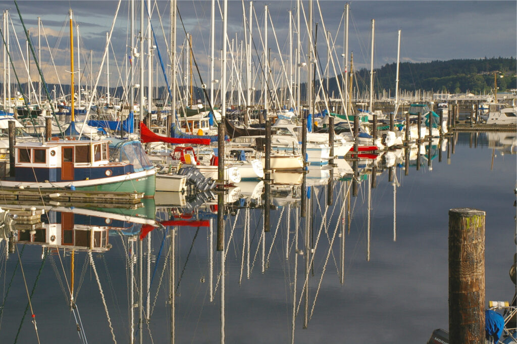 sailboats partked in anacortes harbor under stormy skies