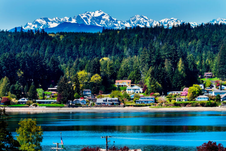 view across the water of a village on bainbridge island near seattle washington