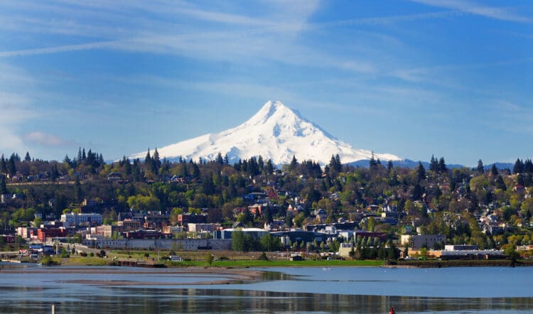 hood river oregon as seen from across columbia river with mt hood in background, one of the best small towns in oregon