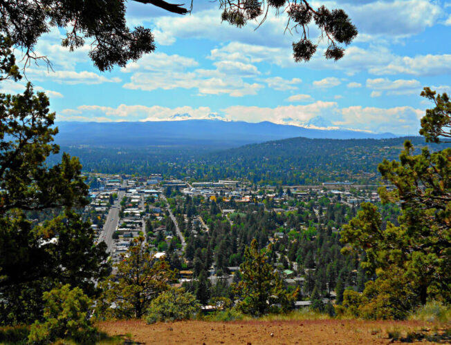 View from the top of Pilot Butte looking over downtown Bend, an easy hike near Bend Oregon on a sunny day