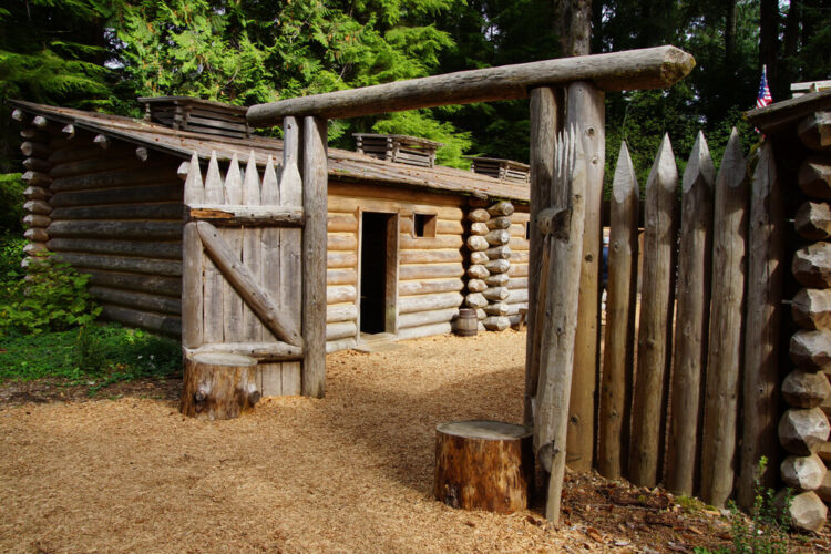 Stockade fence of Fort Clatsop, re-construction at Lewis and Clark National Historical Park, Oregon, made of wooden poles and logs.