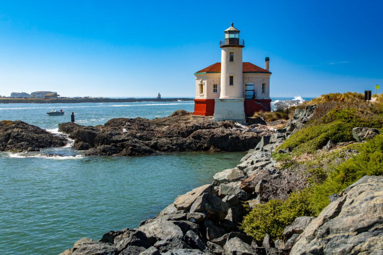 bandon lighthouse as seen from the rocky shore