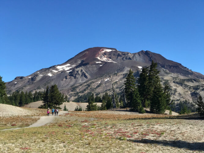 Hiking trail near Bend, Oregon on the way to South Sister volcano, with some snow patches, on a super sunny day.