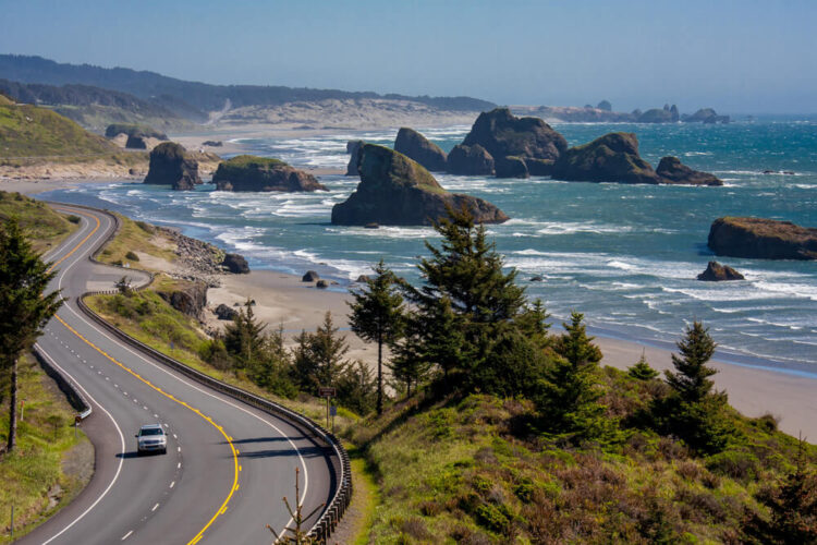 Oregon Coast Highway near Cannon Beach Oregon, USA, passing the rock formations in the Pacific while on an Oregon coast road trip