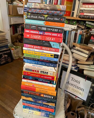 a stack of books on a chair