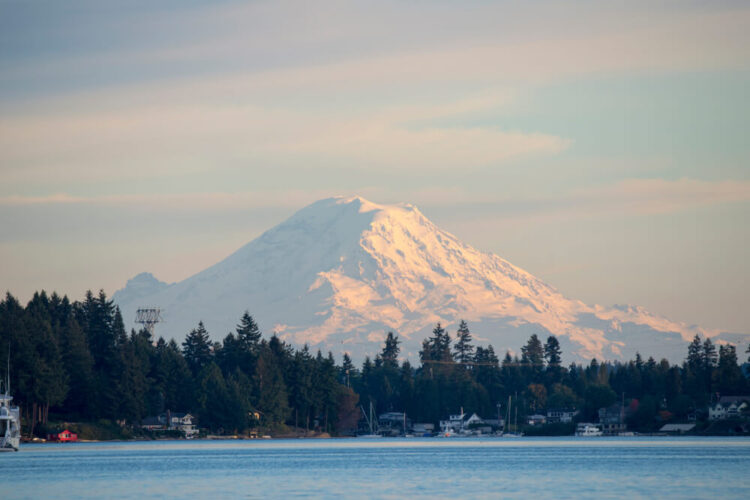 glacier of mt rainier looming over the beautiful harbor of poulsbo washington