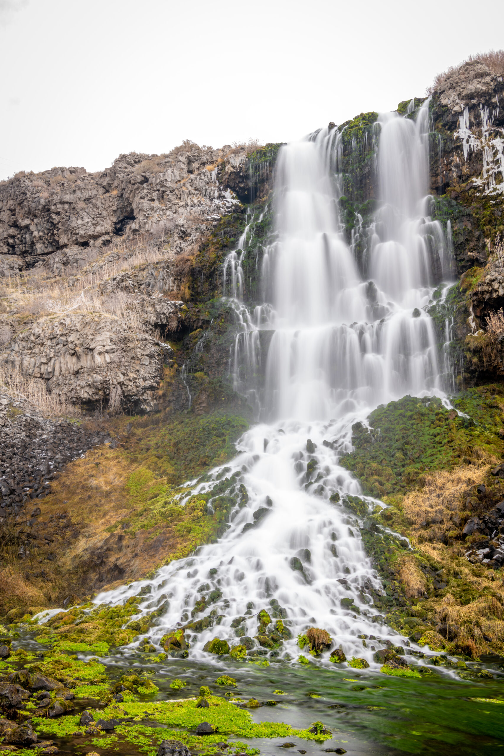 ritter island waterfall in thousand springs state park on a cloudy day, one of the most beautiful waterfalls idaho