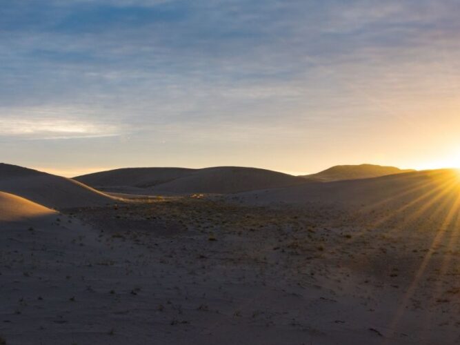 sun rising over the idaho sand dunes on a cool getaway in idaho