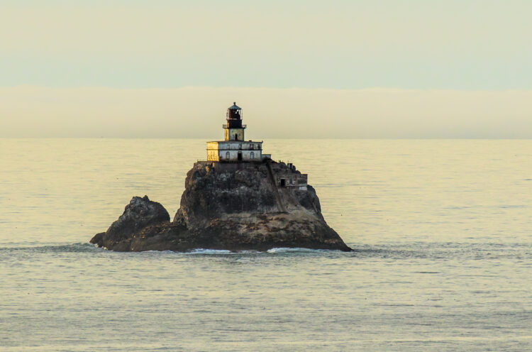 tillamook rock lighthouse on a small island in ocean off of oregon state
